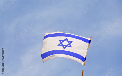 75 years since the founding of the State of Israel. Flag of Israel. State symbol. Flag of Israel on the background of the Wailing Wall. 