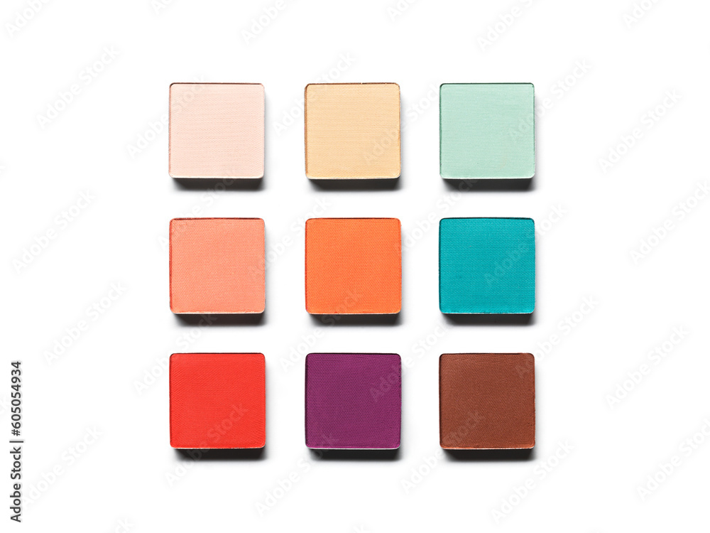 Eye shadow pans nude puple blue green brown orange isolated on white background. Cosmetic product swatch Eye shadow pans nude puple blue green brown orange isolated on white background. Cosmetic product swatch