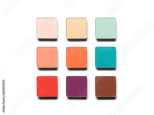 Eye shadow pans nude puple blue green brown orange isolated on white background. Cosmetic product swatch