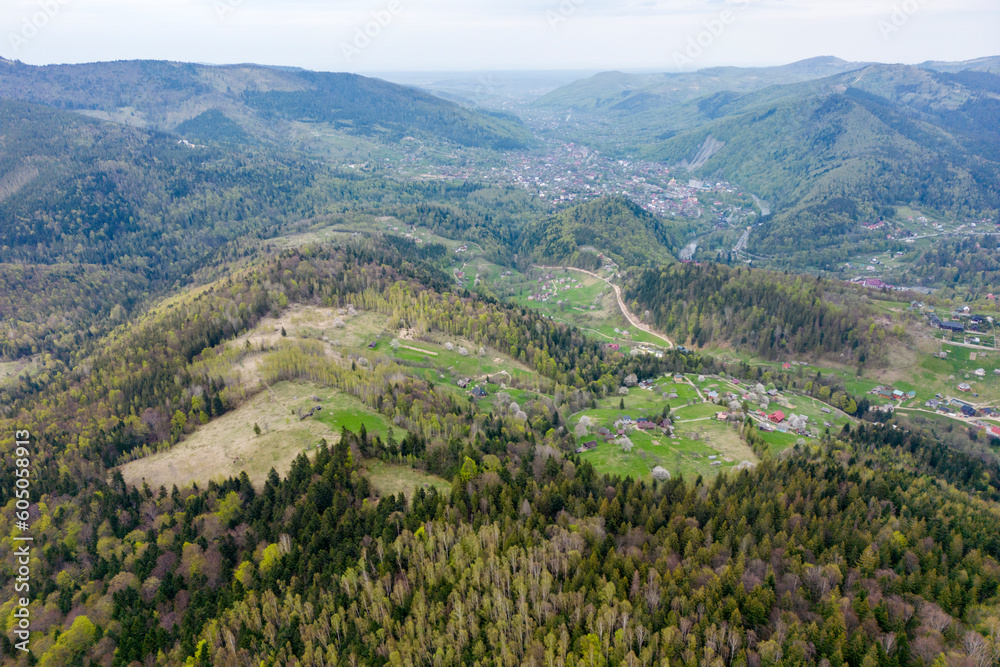 An aerial view of the mountain Yaremche town from above, green Carpathian mountains