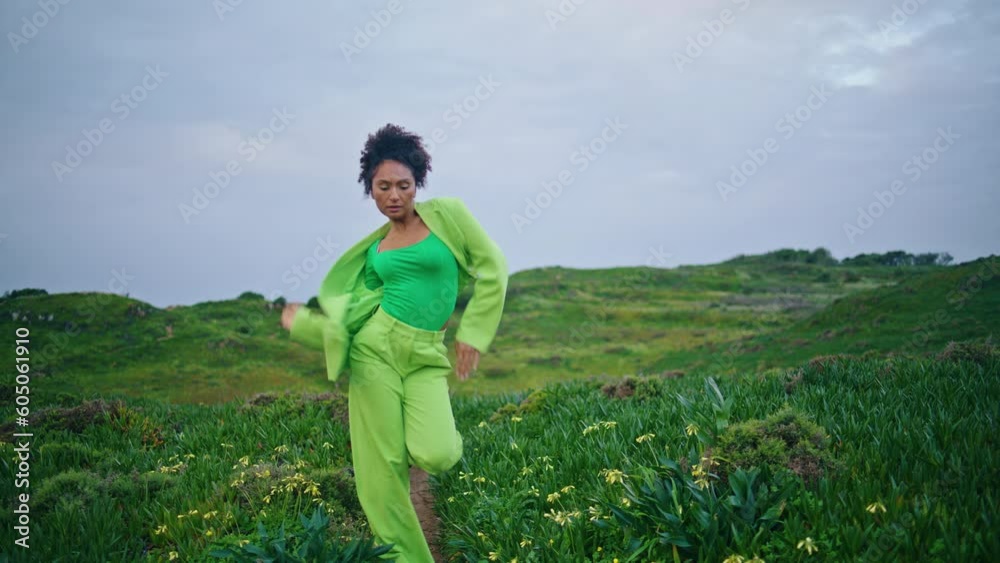 Expressive girl artist dancing outdoors performing modern style at cloudy nature Expressive girl artist dancing outdoors performing modern style at cloudy nature
