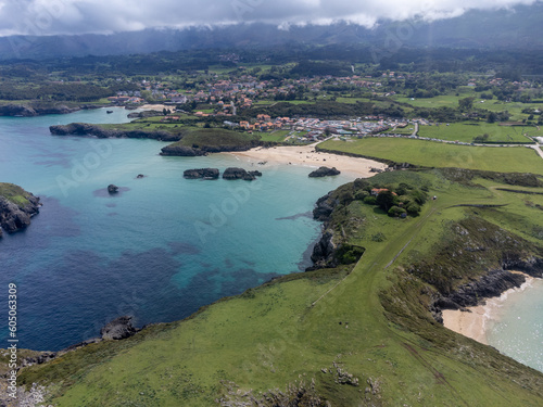 Aerial view on Playa de Palombina, Las Camaras and Celorio, Green coast of Asturias, North Spain with sandy beaches, cliffs, hidden caves, green fields and mountains. photo