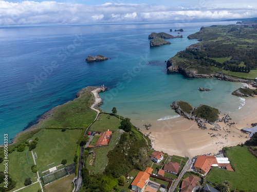 Aerial view on Playa de Palombina, Las Camaras and Celorio, Green coast of Asturias, North Spain with sandy beaches, cliffs, hidden caves, green fields and mountains. photo