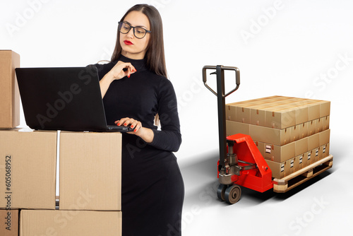Businesswoman with boxes. W...