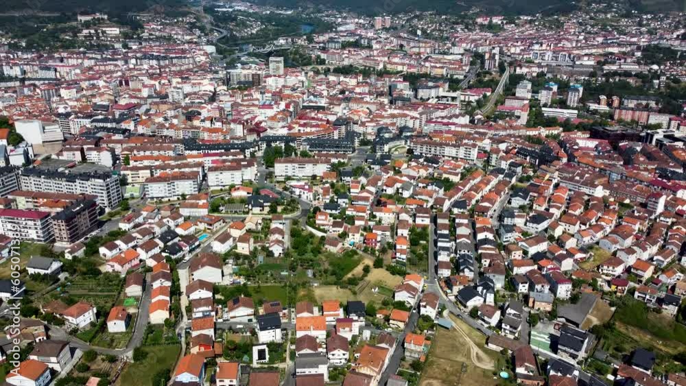 Aerial tilt down reveals neighborhod homes of ourense, galicia, spain Aerial tilt down reveals neighborhod homes of ourense, galicia, spain