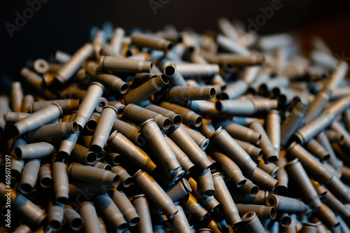 Bullet casings pile in weapon production plant storage