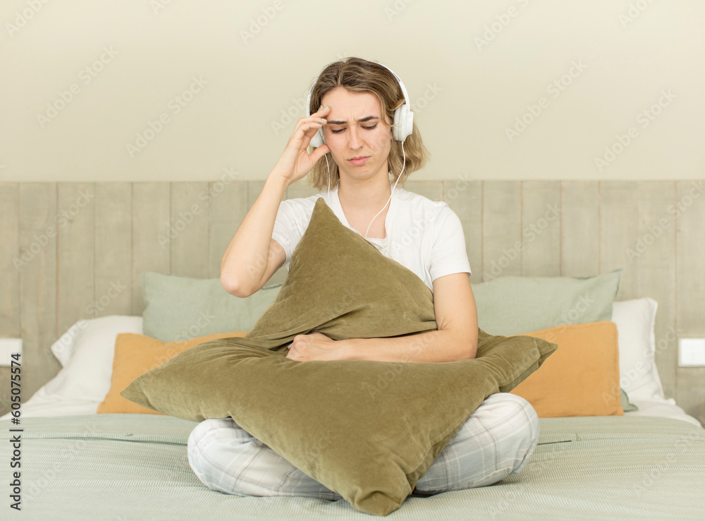pretty woman looking surprised, realizing a new thought, idea or concept. nightwear and bedroom concept pretty woman looking surprised, realizing a new thought, idea or concept. nightwear and bedroom concept