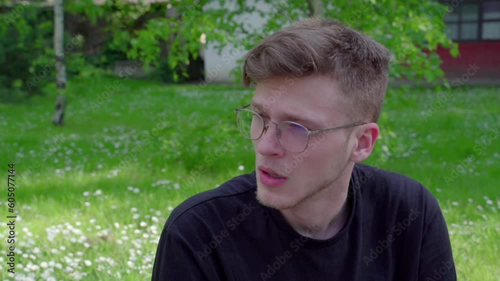 Closeup shot, young man in the park having pollen allergic reaction. Sneezing Closeup shot, young man in the park having pollen allergic reaction. Sneezing