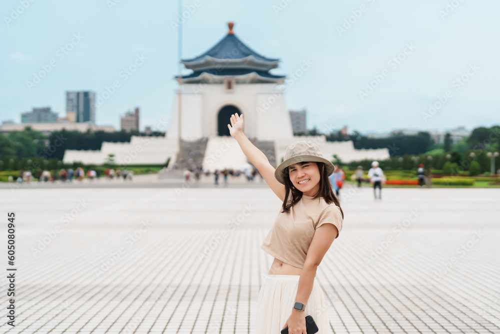 woman traveler visiting in Taiwan, Tourist with hat sightseeing in National Chiang Kai shek Memorial or Hall Freedom Square, Taipei City. landmark and popular attractions. Asia Travel concept - obrazy, fototapety, plakaty 