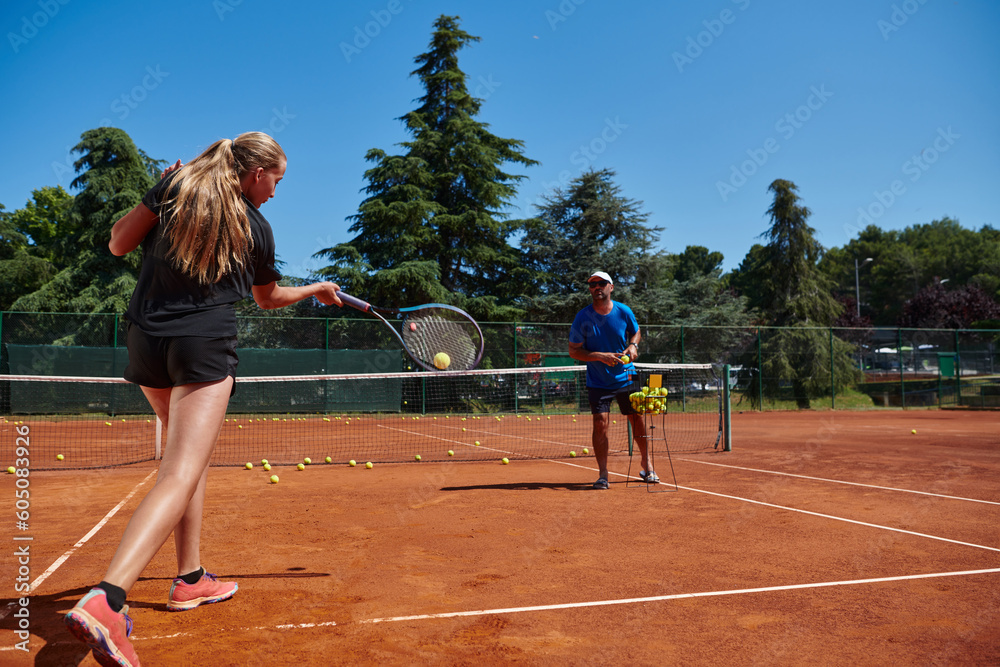 Obraz premium A professional tennis player and her coach training on a sunny day at the tennis court. Training and preparation of a professional tennis player