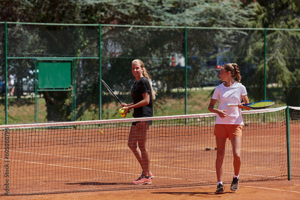 Tennis players standing together on the tennis court, poised and focused, preparing for the start of their match