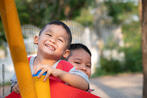 Happy Asian Kids playing on playground 