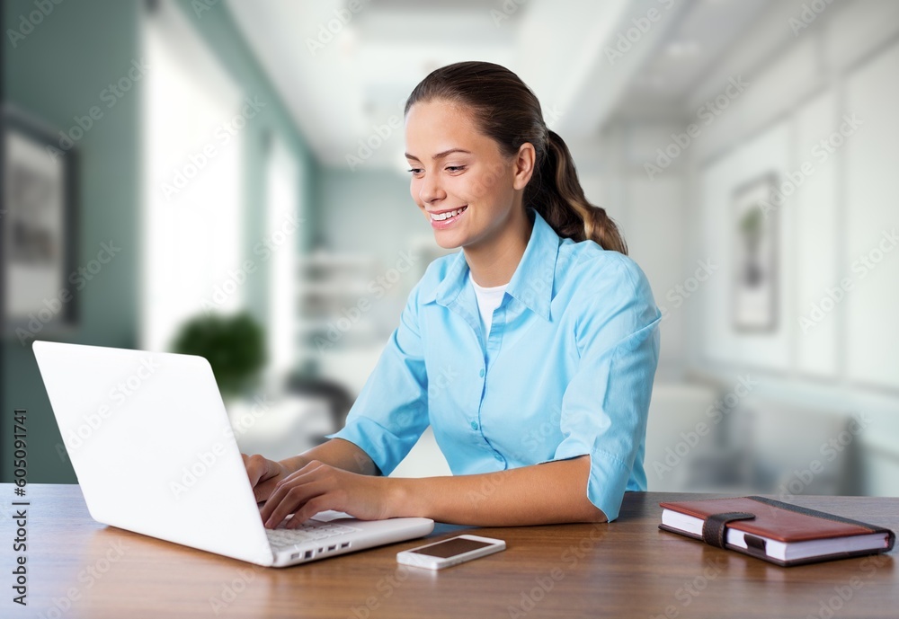 Beautiful Young female Manager works on computer Beautiful Young female Manager works on computer