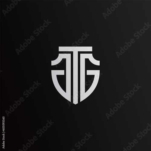 A T J shield letter logo