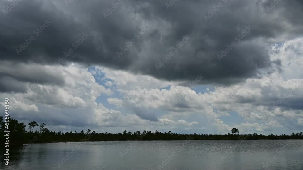Time lapse of storm clouds forming in unsettled atmosphere above Pine Glades Lake in Everglades National Park, Florida 4K. Time lapse of storm clouds forming in unsettled atmosphere above Pine Glades Lake in Everglades National Park, Florida 4K.