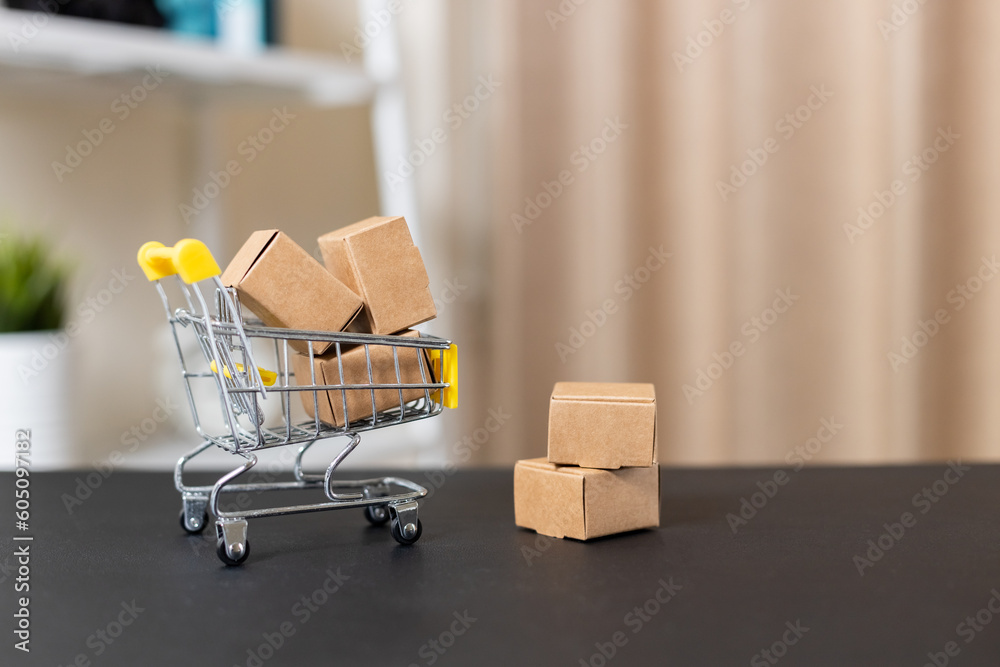 Shopping online and logistic concept. paper box in shopping cart. home delivery service. Supermarket online ordering. import export, finance commerce.