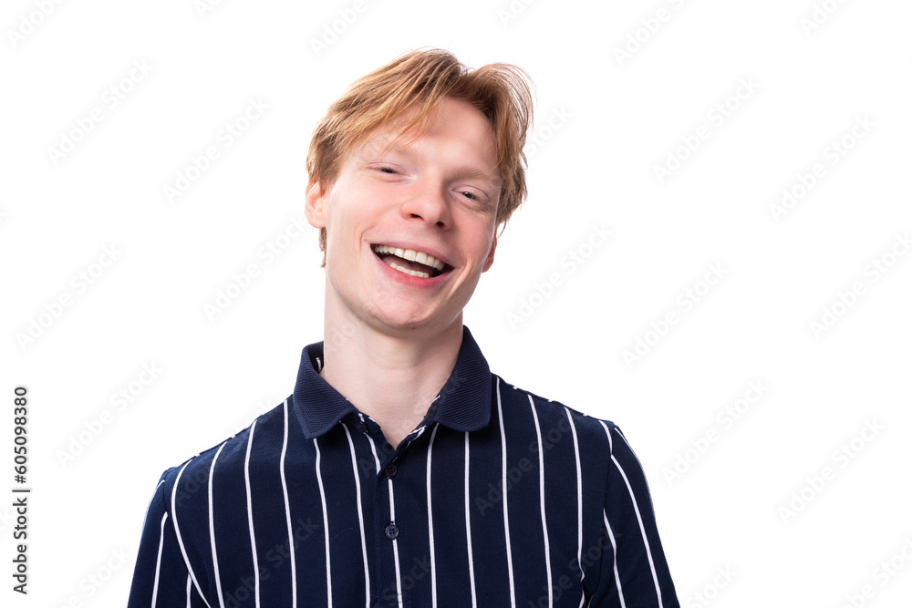 portrait of a well-groomed handsome European 25s blond man in a blue polo portrait of a well-groomed handsome European 25s blond man in a blue polo