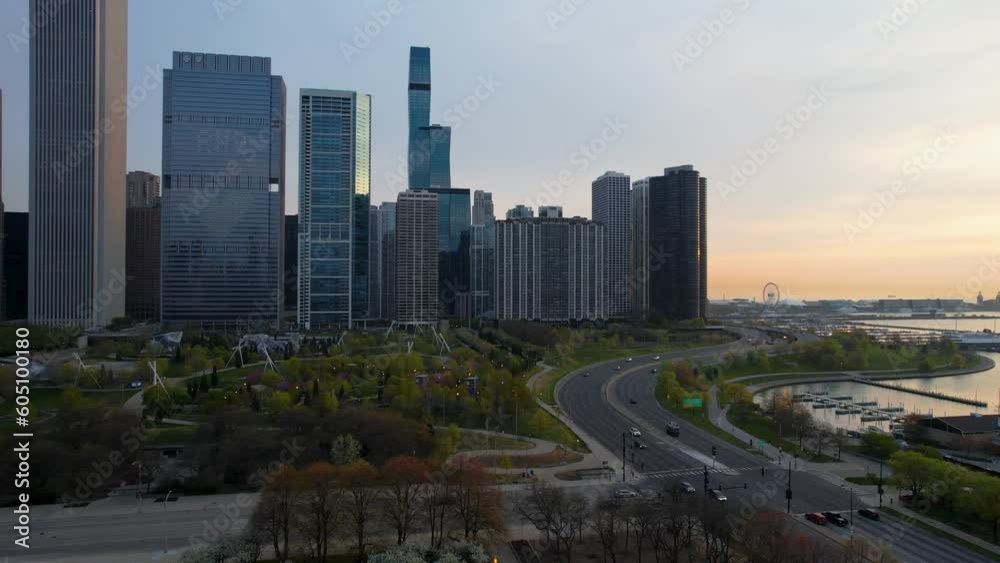 Cars Driving Through Green Urban City Center At Sunrise Drone Cars Driving Through Green Urban City Center At Sunrise Drone