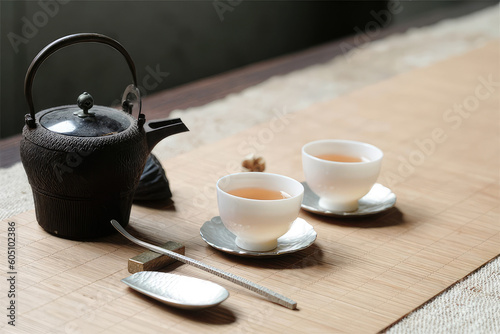 A set of tea pot and cup on the table. Tea for relaxation and mindfulness 