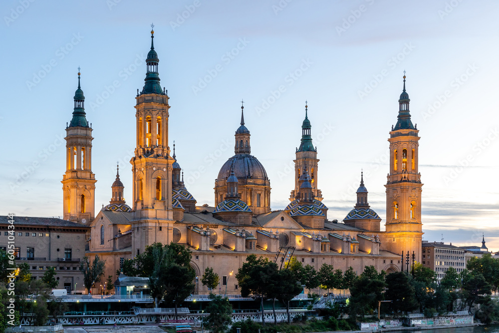 Zaragoza, Spain - May 01, 2023: ebro river, in front of the Basilica del Pilar, with very low water level due to drought and climate change in Zaragoza, Spain