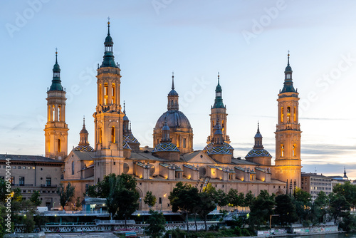 Zaragoza, Spain - May 01, 2023: ebro river, in front of the Basilica del Pilar, with very low water level due to drought and climate change in Zaragoza, Spain