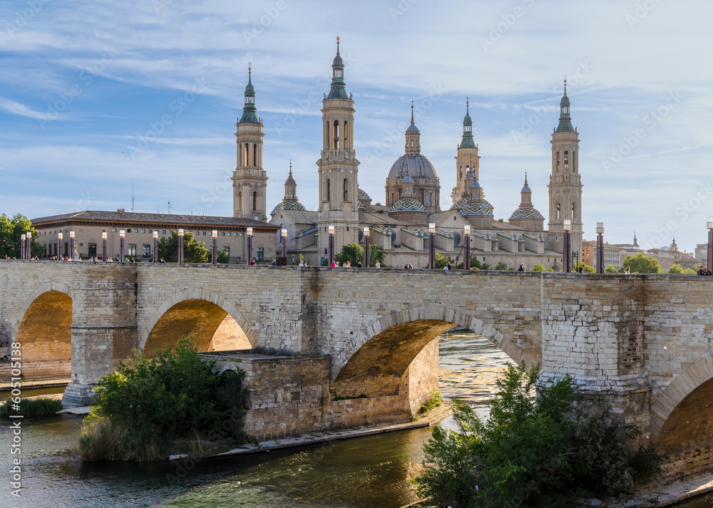 Zaragoza, Spain - May 01, 2023: medieval bridge called Puente de Piedra that crosses the Ebro river as it passes through the city of Zaragoza, Spain