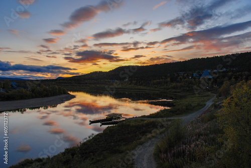 Beautiful evening sky over Karasjok reflected in Karasjohka River, Finnmark, Norway