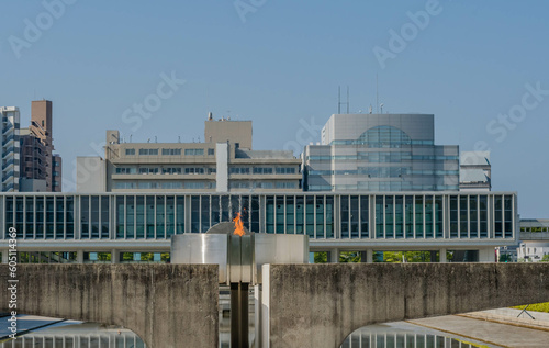 Peace Fire at Memorial Park with city buildings in background. photo