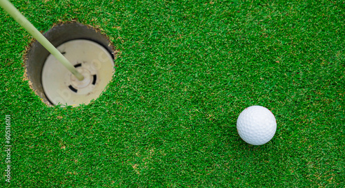 Close up golf ball on green grass field