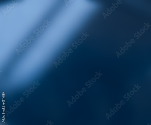 Defocused blurred abstract background, light from a window on a blue wall or in a blue room.