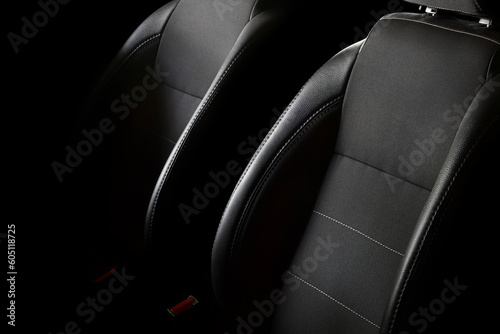 Car seats on a black background. Car seat backrests with lateral support.