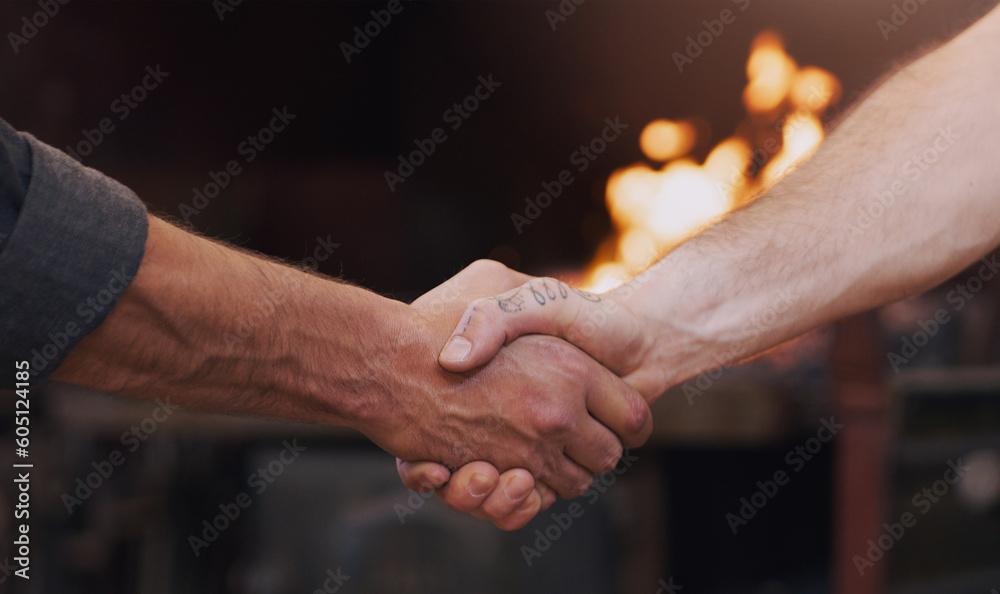 Handshake, meeting and thank you with men in a workshop together for a deal or agreement. Teamwork, welcome and partnership with male industry people shaking hands in a factory to gesture a greeting Handshake, meeting and thank you with men in a workshop together for a deal or agreement. Teamwork, welcome and partnership with male industry people shaking hands in a factory to gesture a greeting