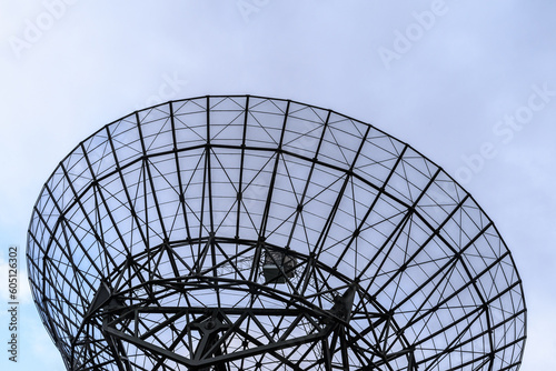 Close up of a radio satellite against a blue sky