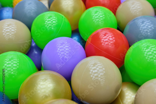 A bunch of colorful plastic balls in the game center. View from above. A place to copy. Close-up