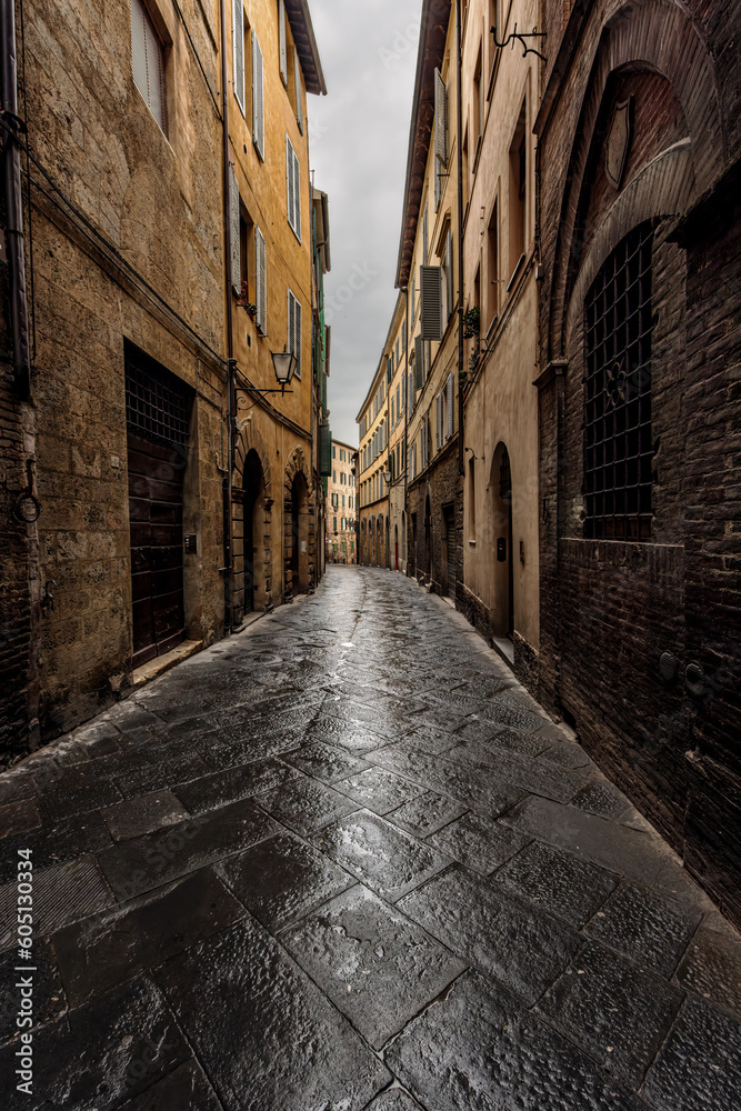 Streets in the old town of Siena, Tuscany, Italy, on a rainy day in spring.