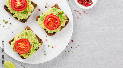 Avocado Toasts with Tomato, Healthy Snack or Breakfast on Bright Background