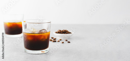 Iced Coffee, Cold Brew Coffee with Ice on Bright Background, Coffee Cocktail, Refreshing Beverage
