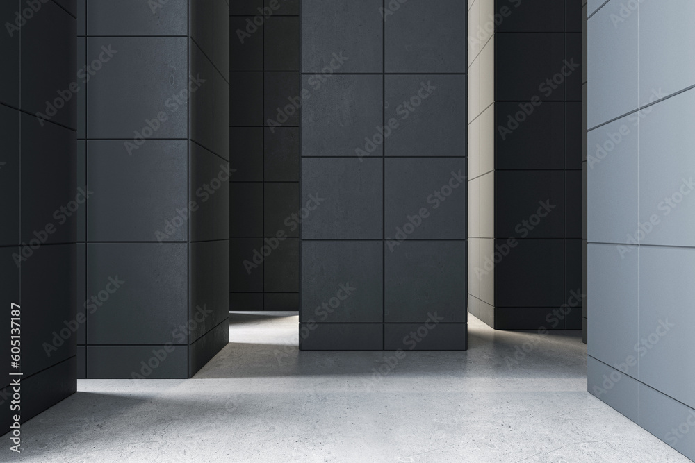 Obraz premium Front view on black huge pillar in abstract outdoor hall with sunlit concrete floor. 3D rendering