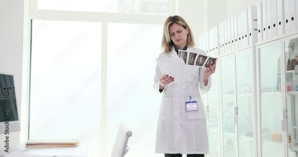 Woman doctor looking at patient medical documents and test results on computer 4k movie slow motion. Work of doctor therapist concept Woman doctor looking at patient medical documents and test results on computer 4k movie slow motion. Work of doctor therapist concept