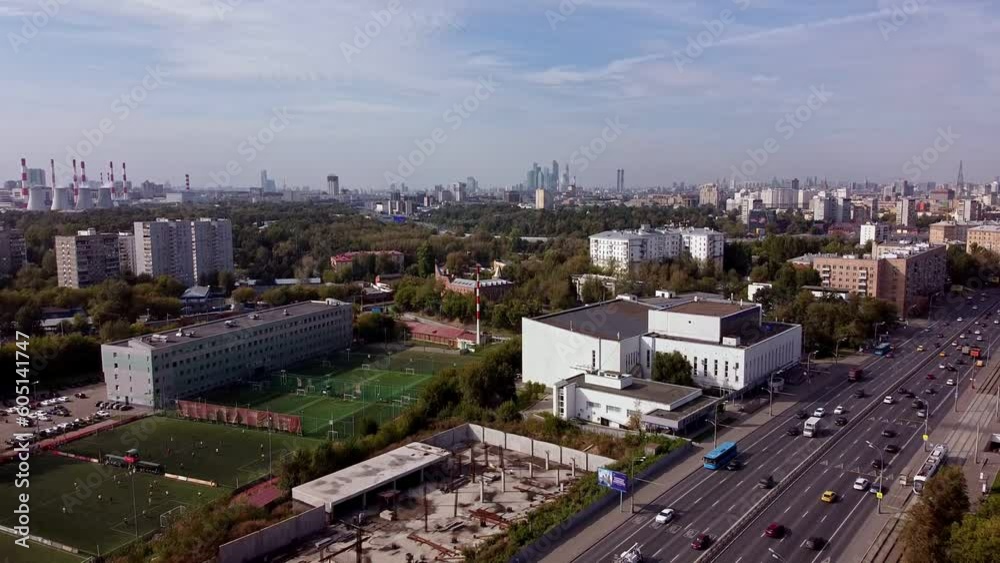 Aerial view of the Trud sports complex in Moscow against the background of the city. Highway city road. Urban landscape with developed infrastructure