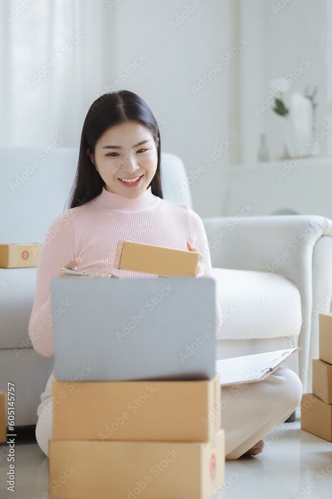 Online Seller, Young Asian store owner, she makes a living selling products online, live selling on social media platforms to reach target audience. Concept of selling products online. Online Seller, Young Asian store owner, she makes a living selling products online, live selling on social media platforms to reach target audience. Concept of selling products online.