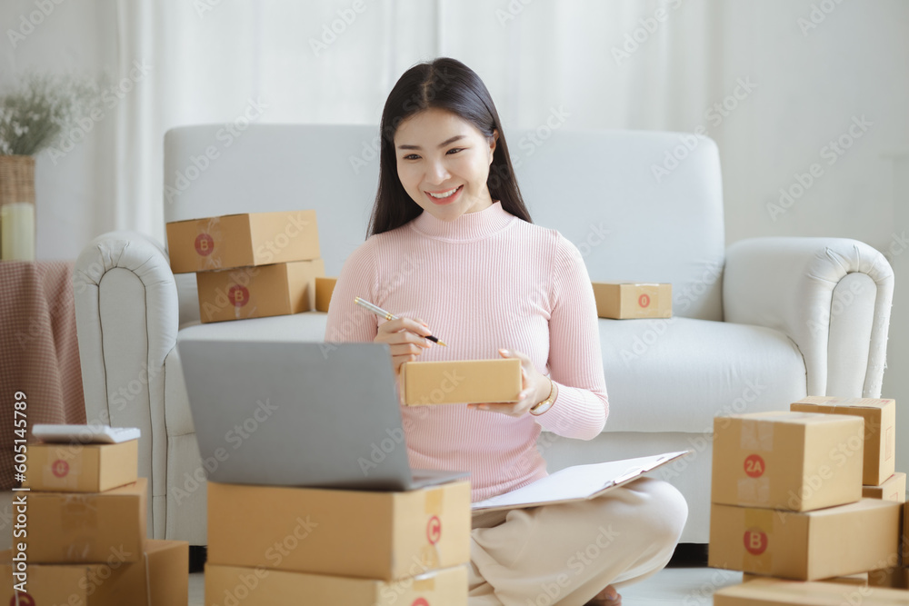Online Seller, Young Asian store owner, she makes a living selling products online, live selling on social media platforms to reach target audience. Concept of selling products online. Online Seller, Young Asian store owner, she makes a living selling products online, live selling on social media platforms to reach target audience. Concept of selling products online.