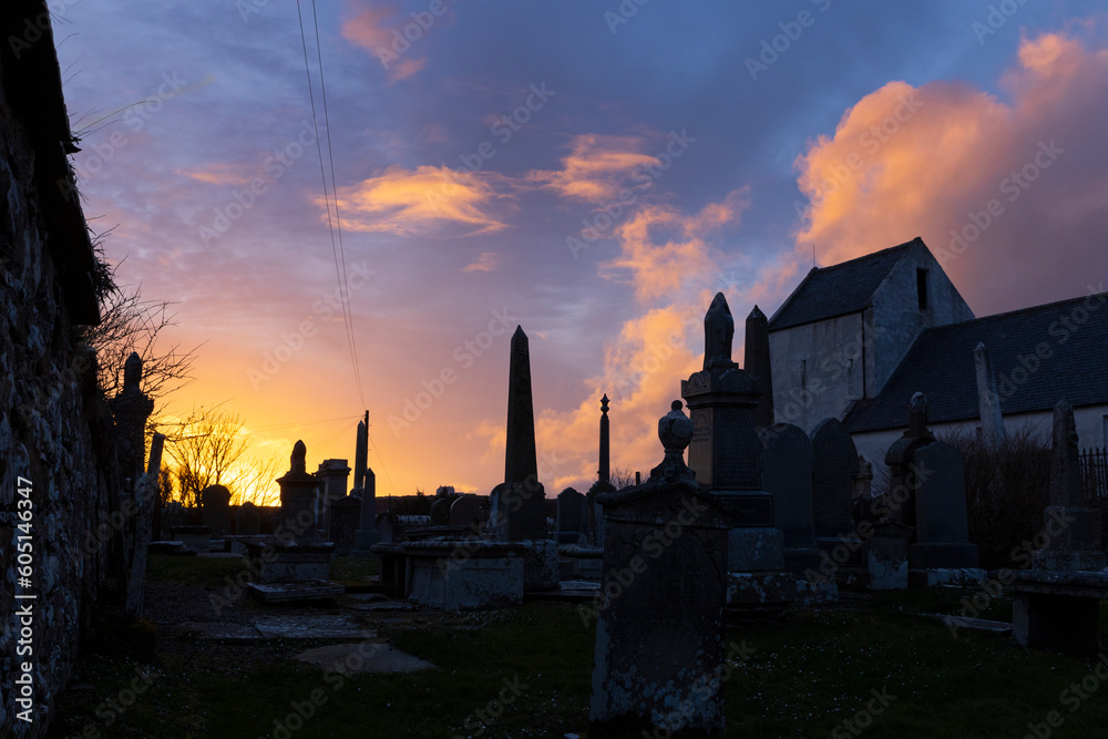 Sunset. Cemetry and thombstones at Dunnet Head. Nothern Scotland. Coast North sea. Church.