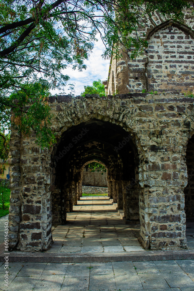 Archways in one of the dilapidated tomb structure at Qutb Shahi Archaeological Park, Hyderabad, India