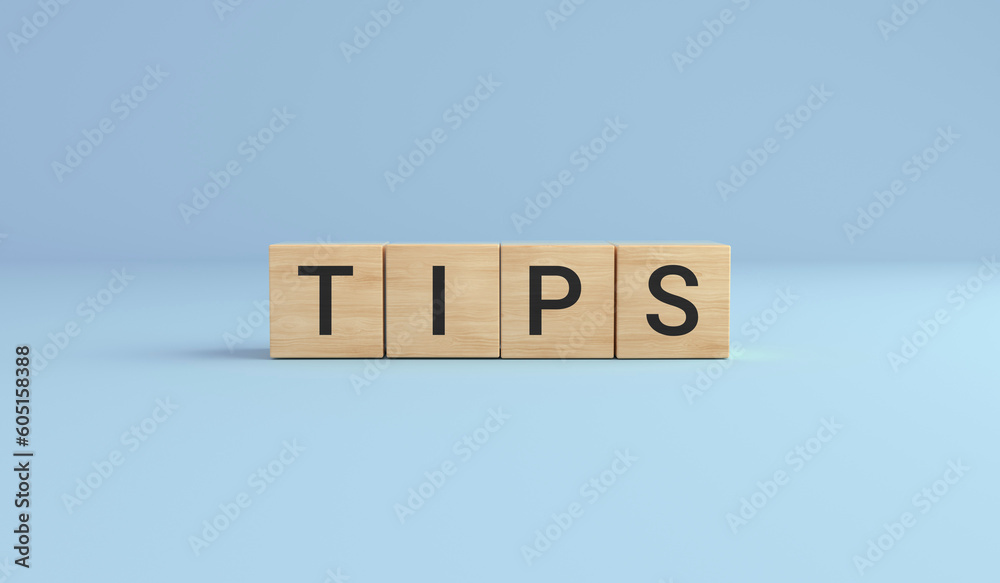 Tips written on wooden cubes on the blue background. Tips written on wooden cubes on the blue background.
