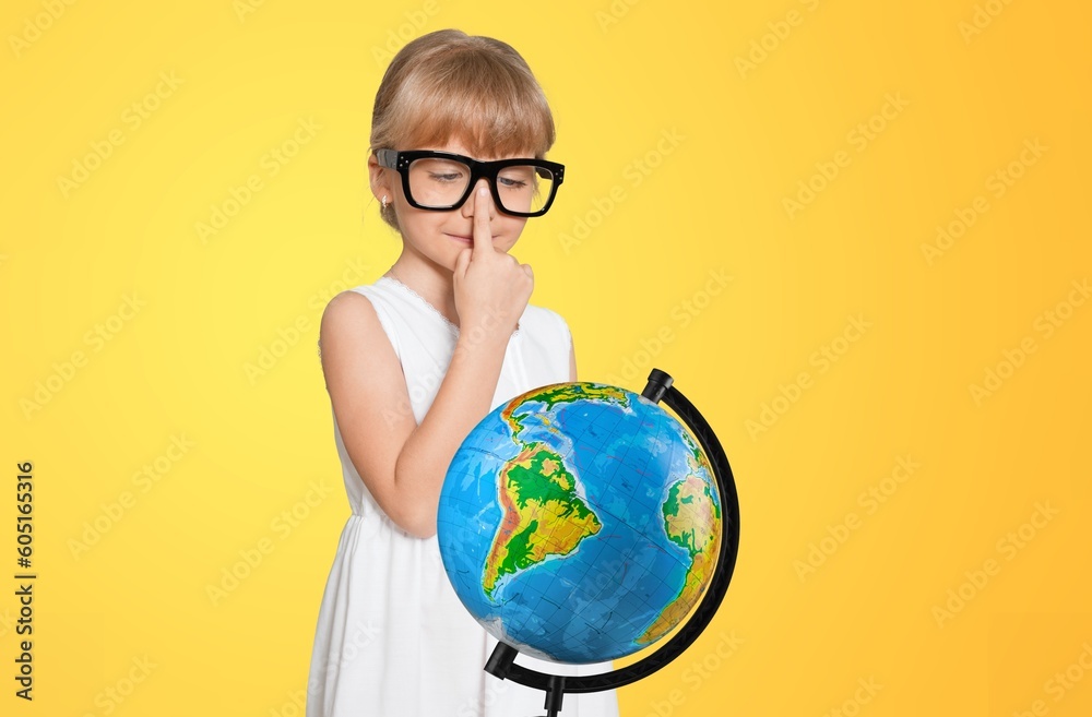 Cheerful student child with globe. School concept. Cheerful student child with globe. School concept.