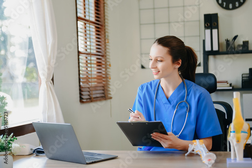 Medical technology concept. Doctor working with mobile phone and stethoscope in modern office