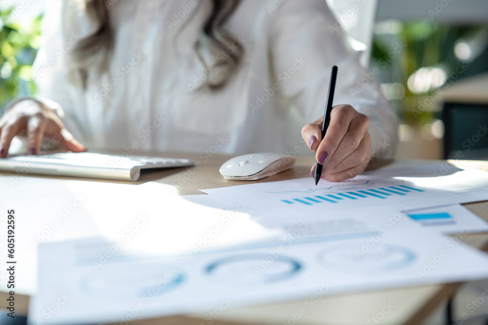 Close up of a woman making notes and working with schemes Close up of a woman making notes and working with schemes