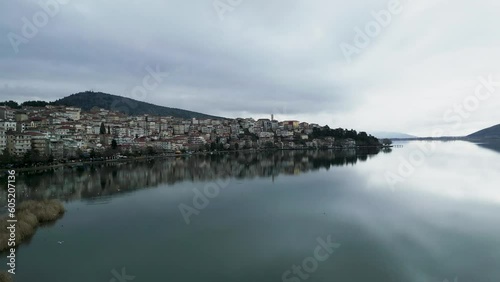 Aerial Cinematic 4K Drone Footage: City of Kastoria, Macedonia, Greece - Lake Reflection and Approach (ID: 605207136)
