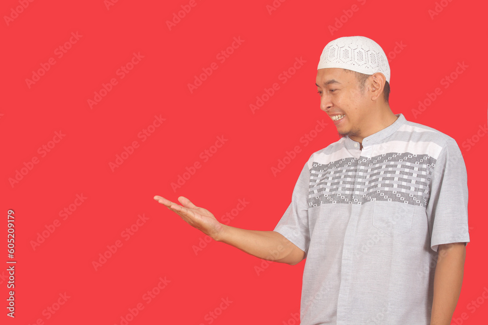 Side view of a man smiling with his hand holding something pose
Side view of a man smiling with his hand holding something pose